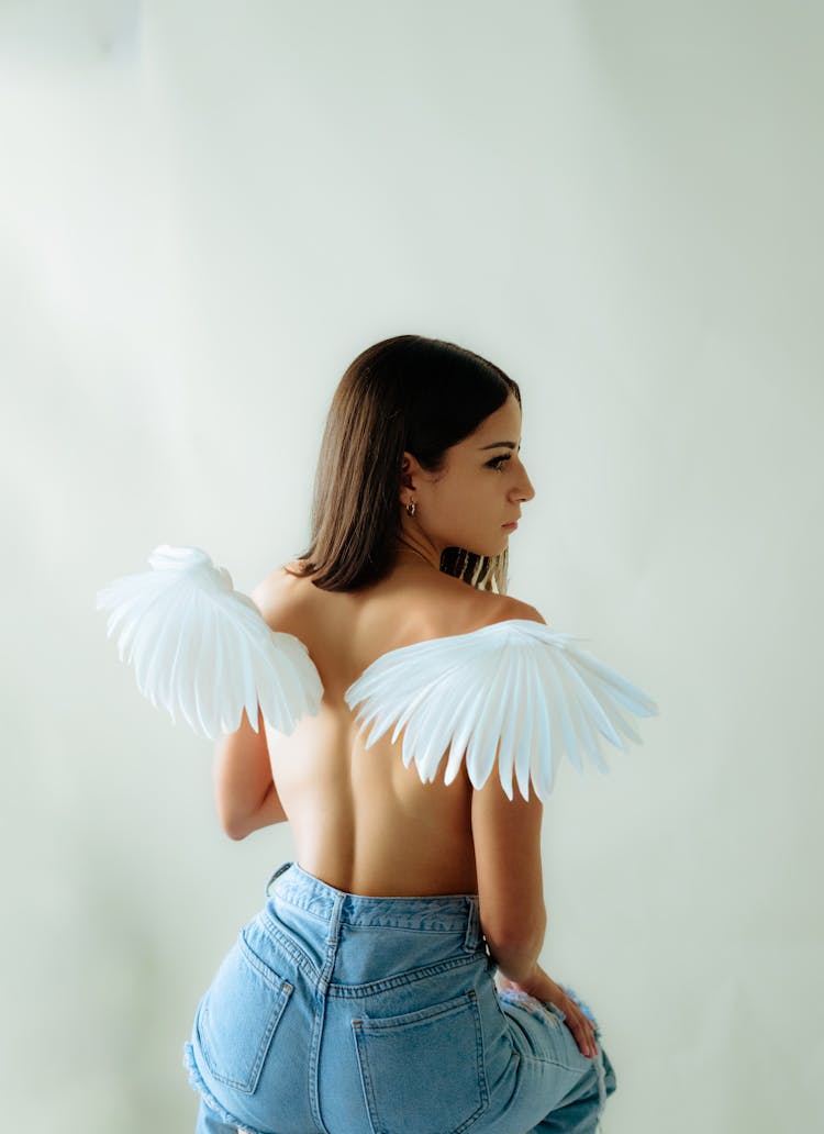 Young Model In Jeans With Angel Wings