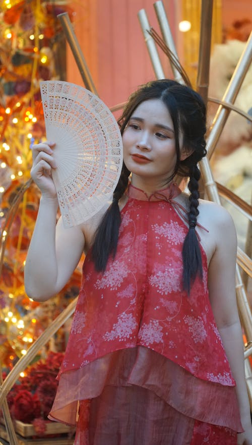 Portrait of Woman in Traditional Clothing and with Fan