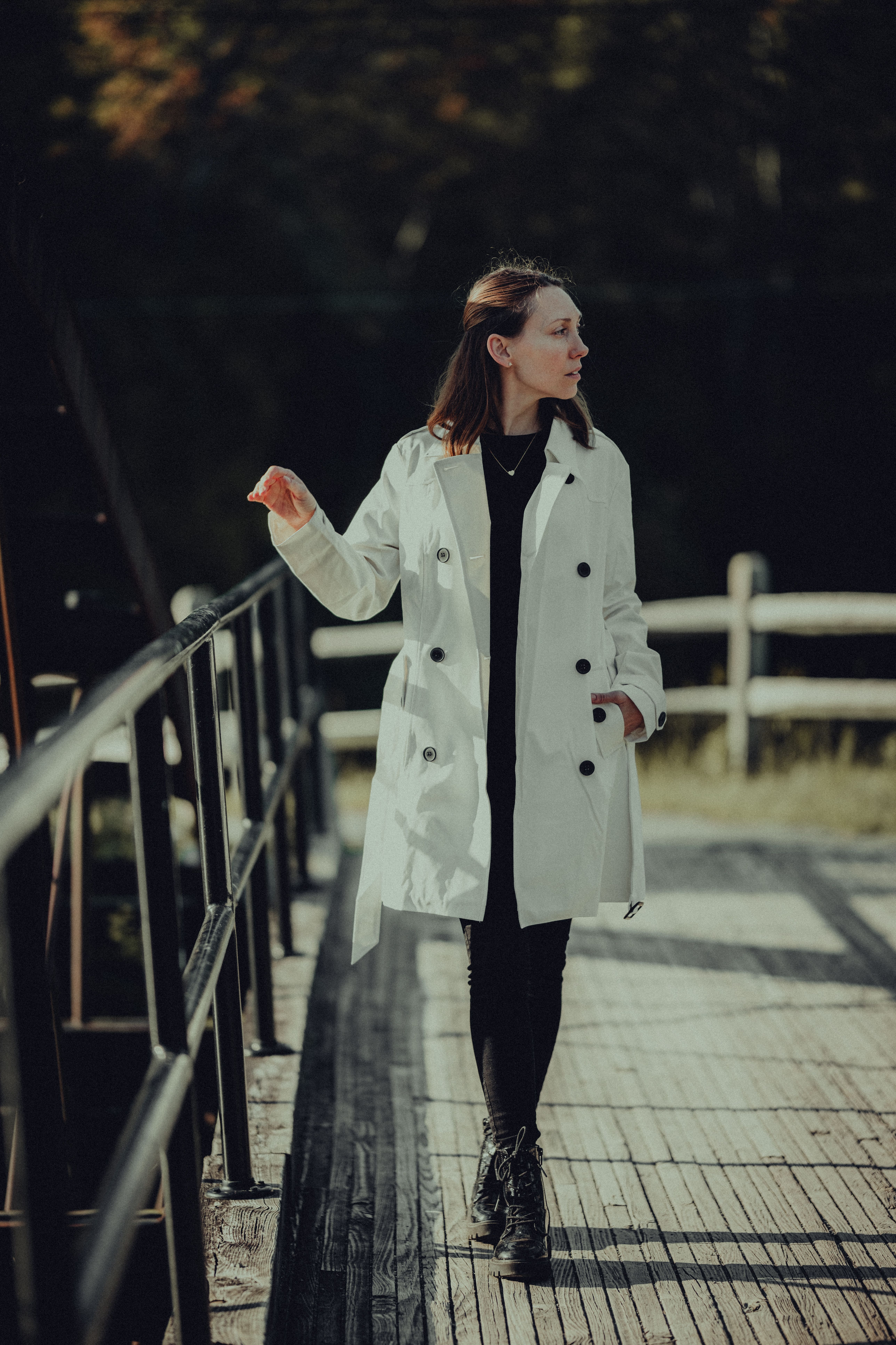 Woman in a Trench Coat Walking Outside · Free Stock Photo