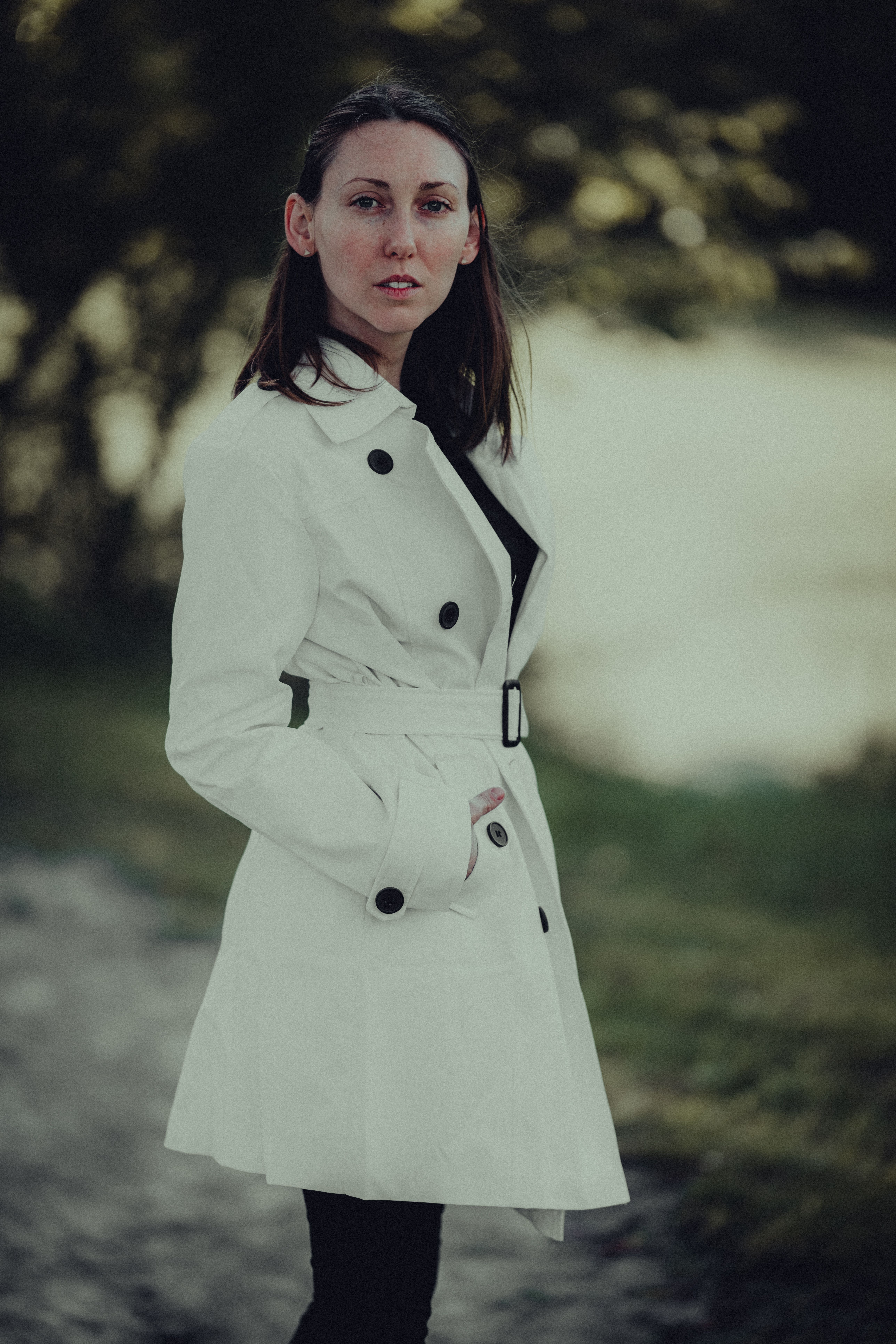 Woman in a Trench Coat Standing Outside · Free Stock Photo