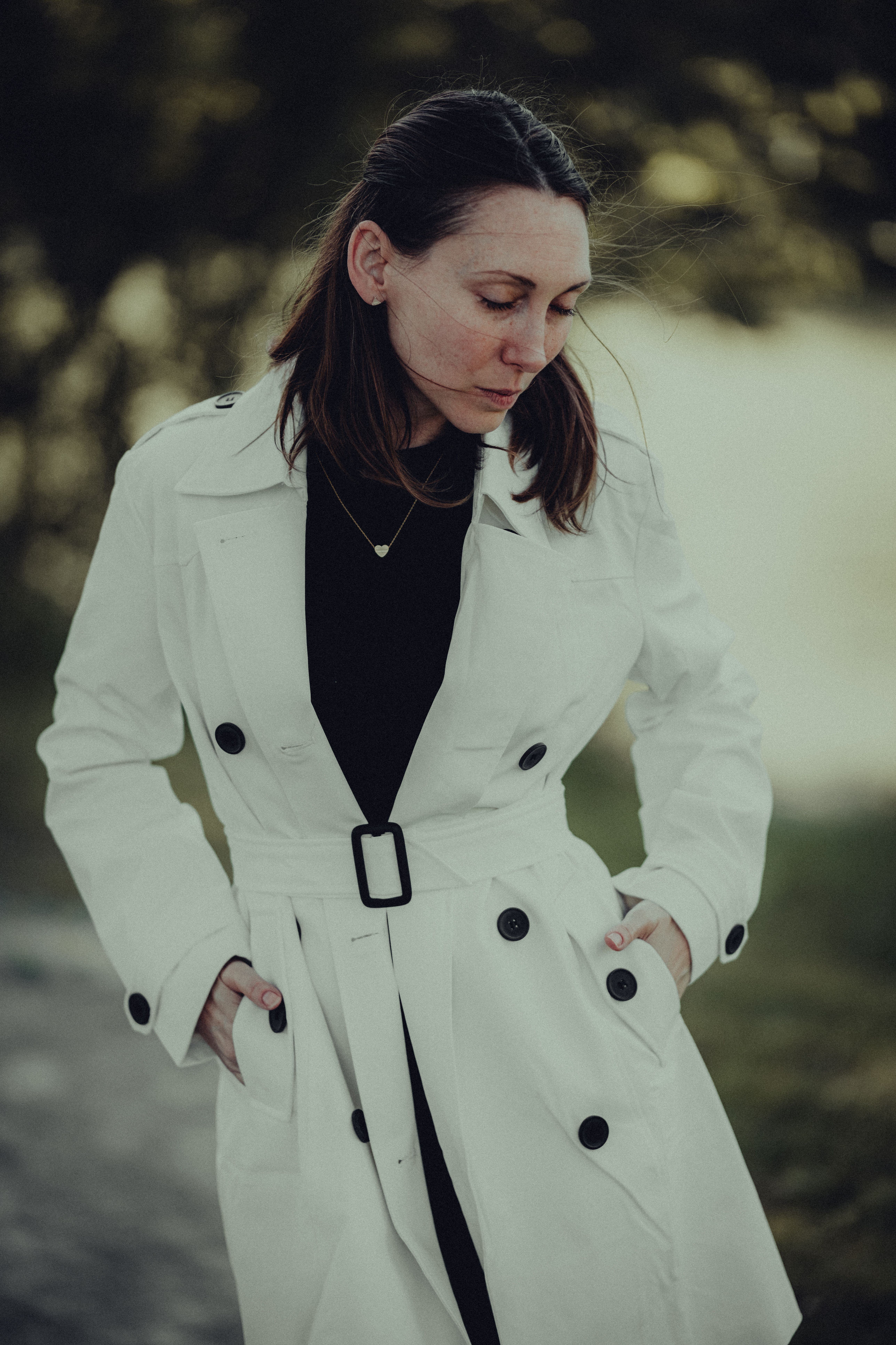 Woman in a Trench Coat Standing Outside · Free Stock Photo