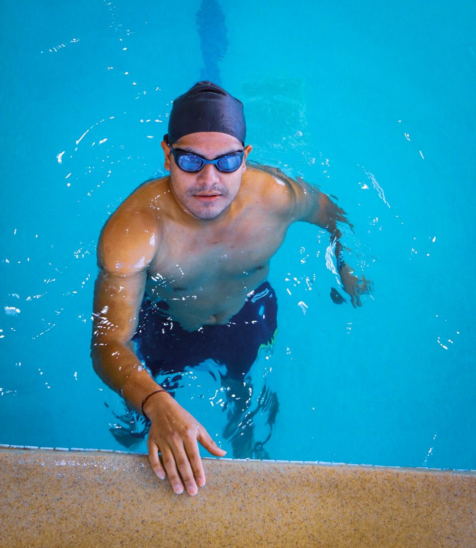 Swimmer training in an indoor pool