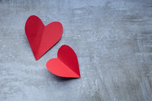 Free Red Heart on Gray Textile Stock Photo