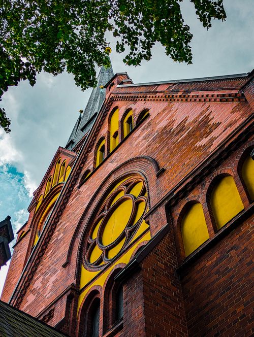 Free Low angle shot of Gothic church facade with arches in Lübeck, Germany. Stock Photo