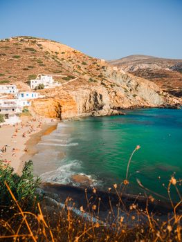 Beautiful view of Agali Bay in Tinos, Greece with sandy beach and turquoise water.