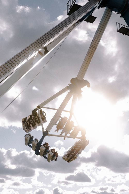 Someone On Ride People in the Air on a Ride at a Fairground · Free Stock Photo