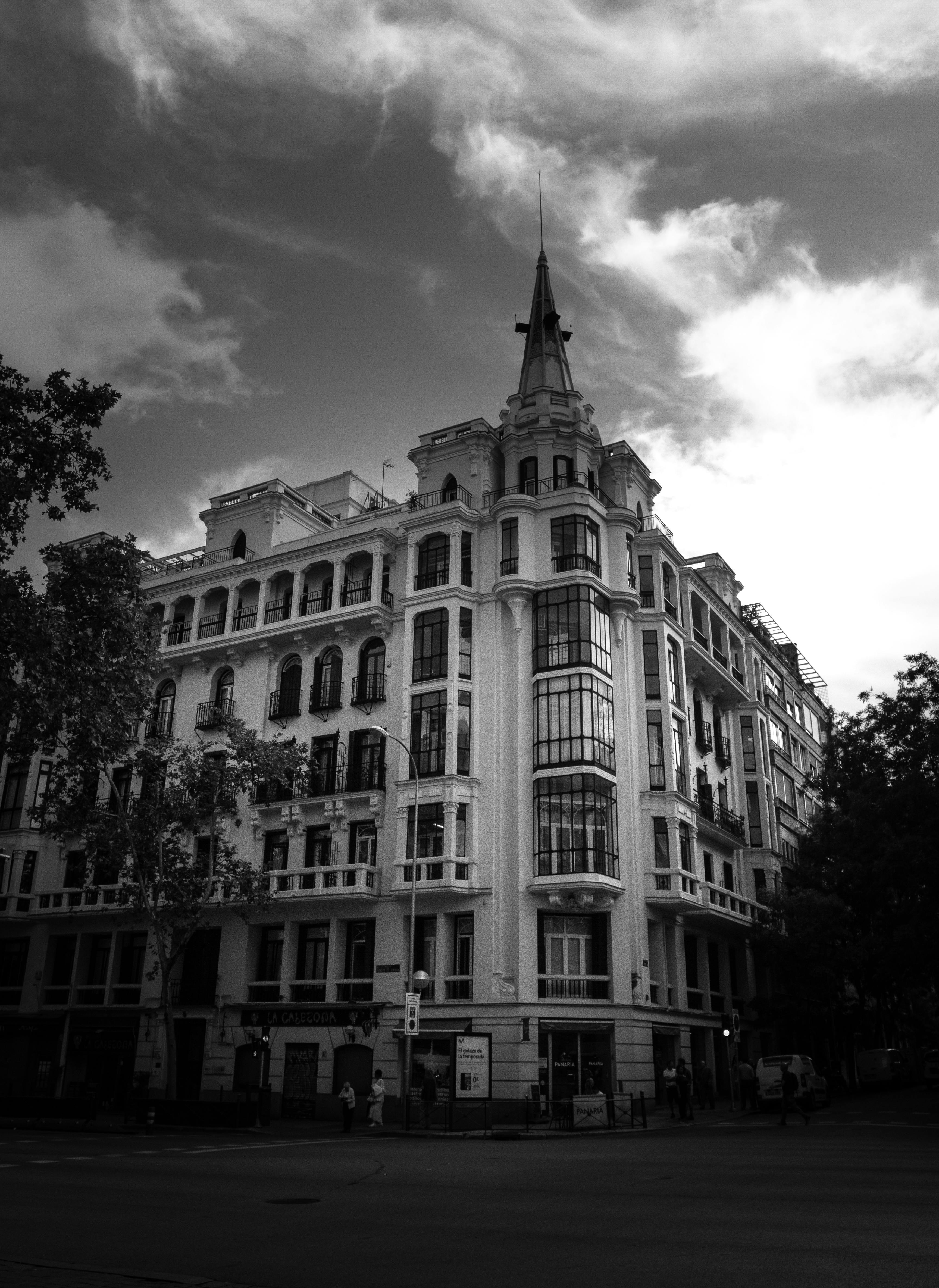Free Fine art photograph of a classic building corner in Madrid, Spain showcasing urban architecture. Stock Photo