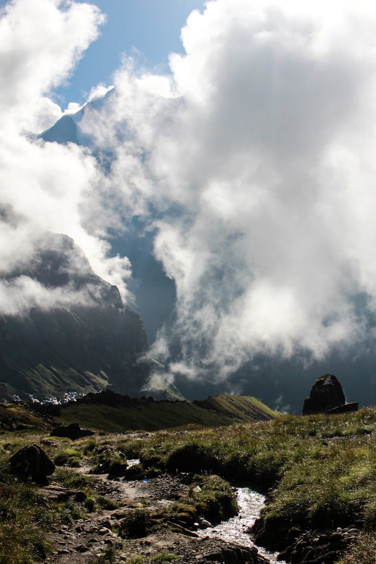 Clouds Hanging Low Over A Mountain Valley Landscape