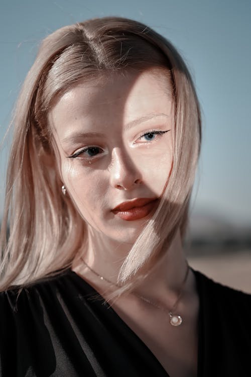 Young Woman With Face Partially Illuminated by Reflected Light