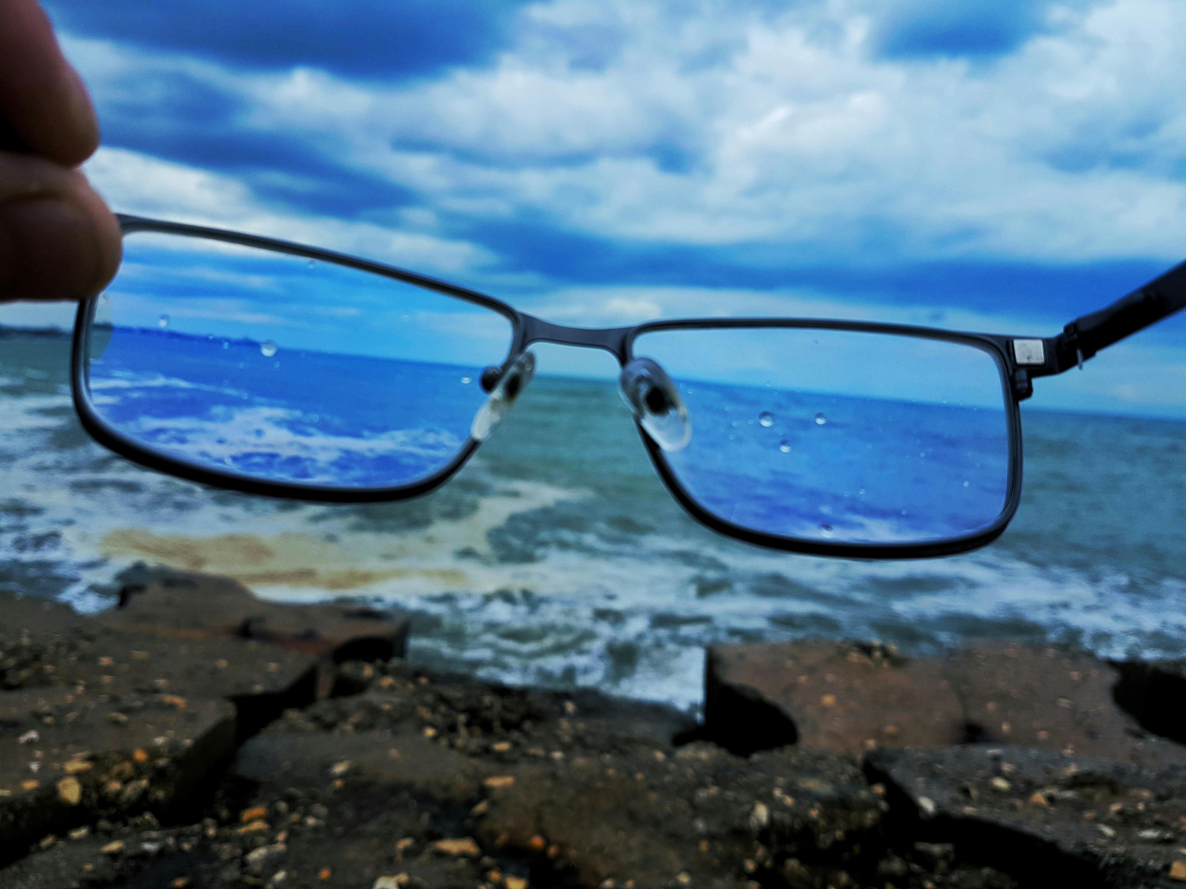 Fan holding a smartphone recording a performance at a concert