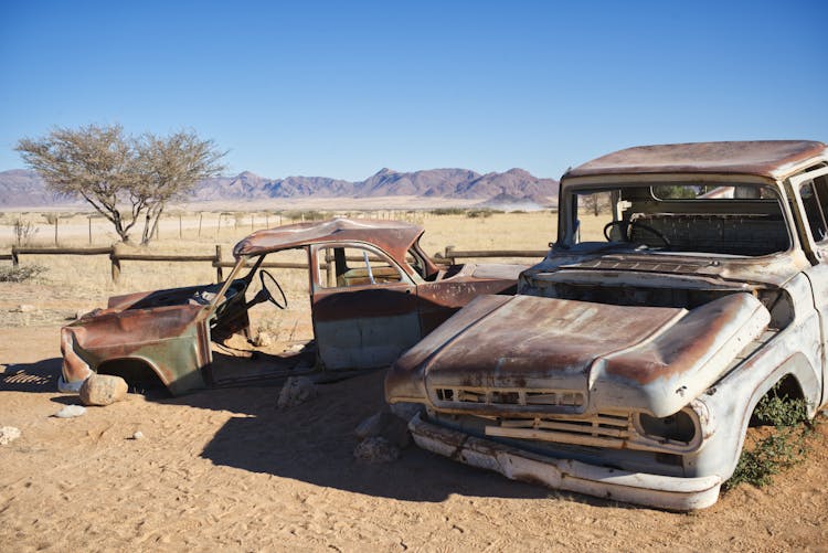 Rusty Broken Cars On The Desert