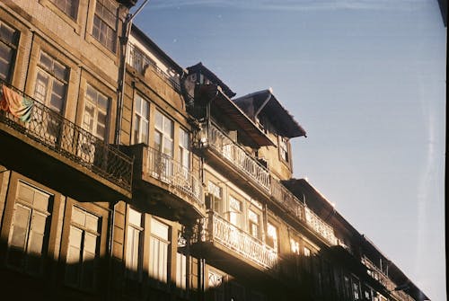 Sunlight Reflecting in Windows of Old Residential Building