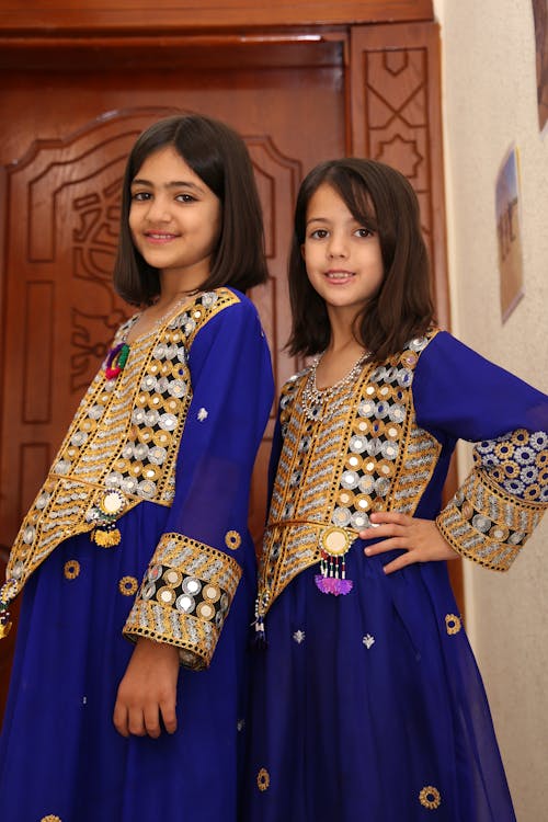 Smiling Girls in Traditional Clothing 