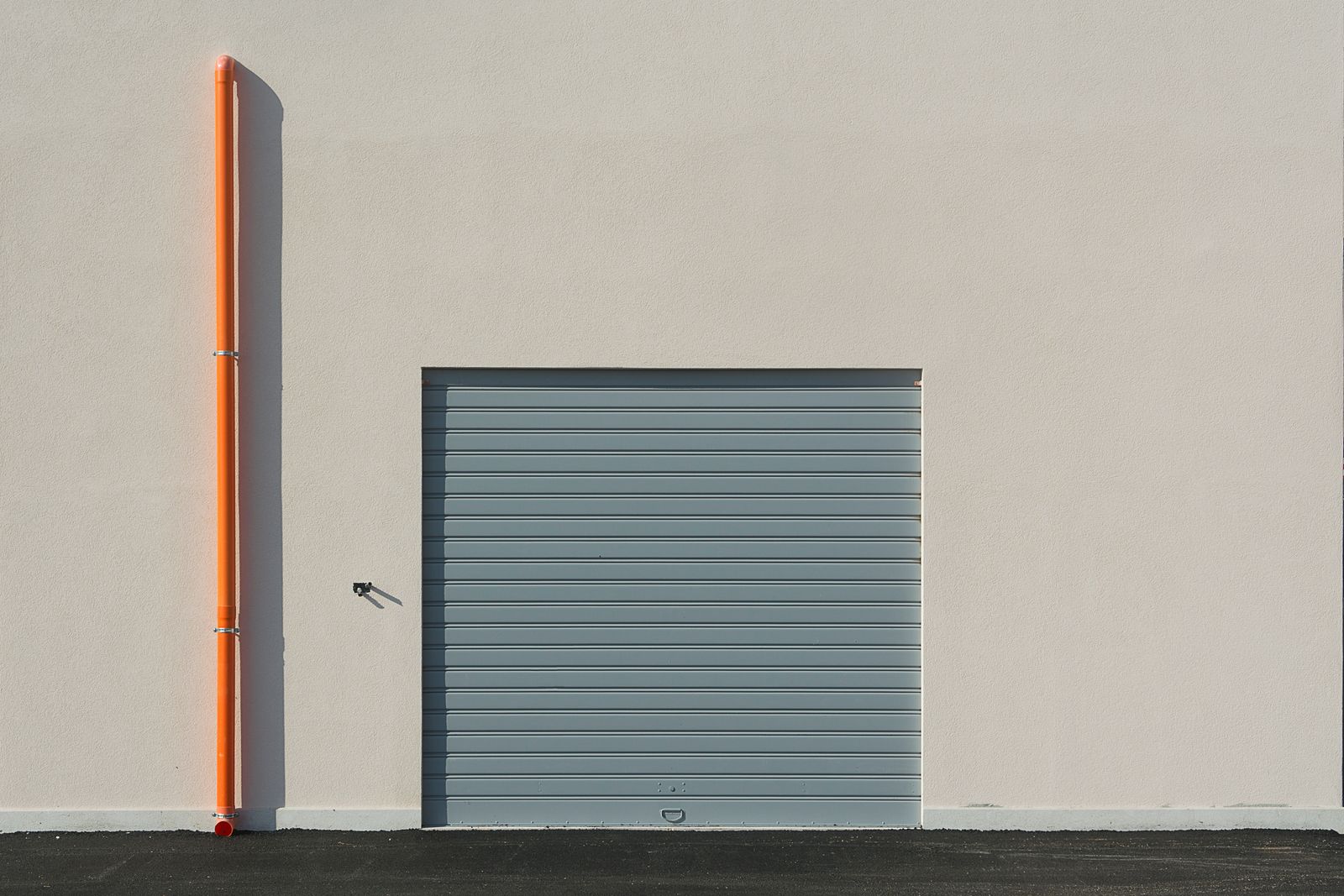 Urban building with a modern garage door.