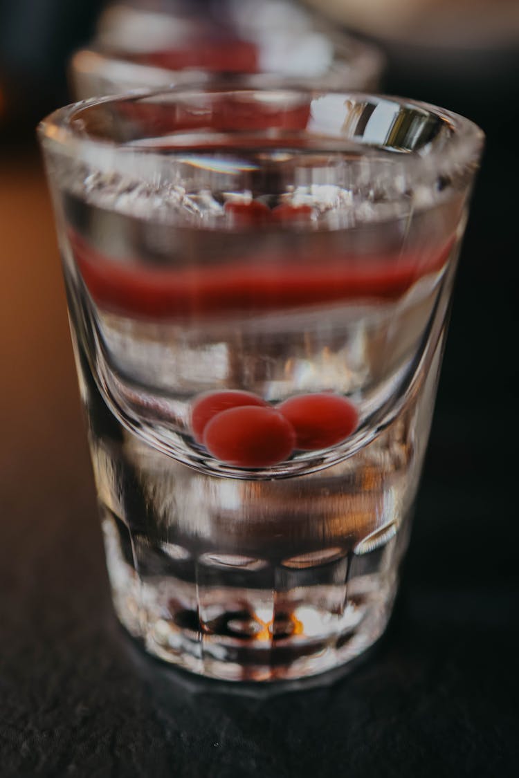 Closeup Of The First Glass In A Row Of Drinks On The Counter