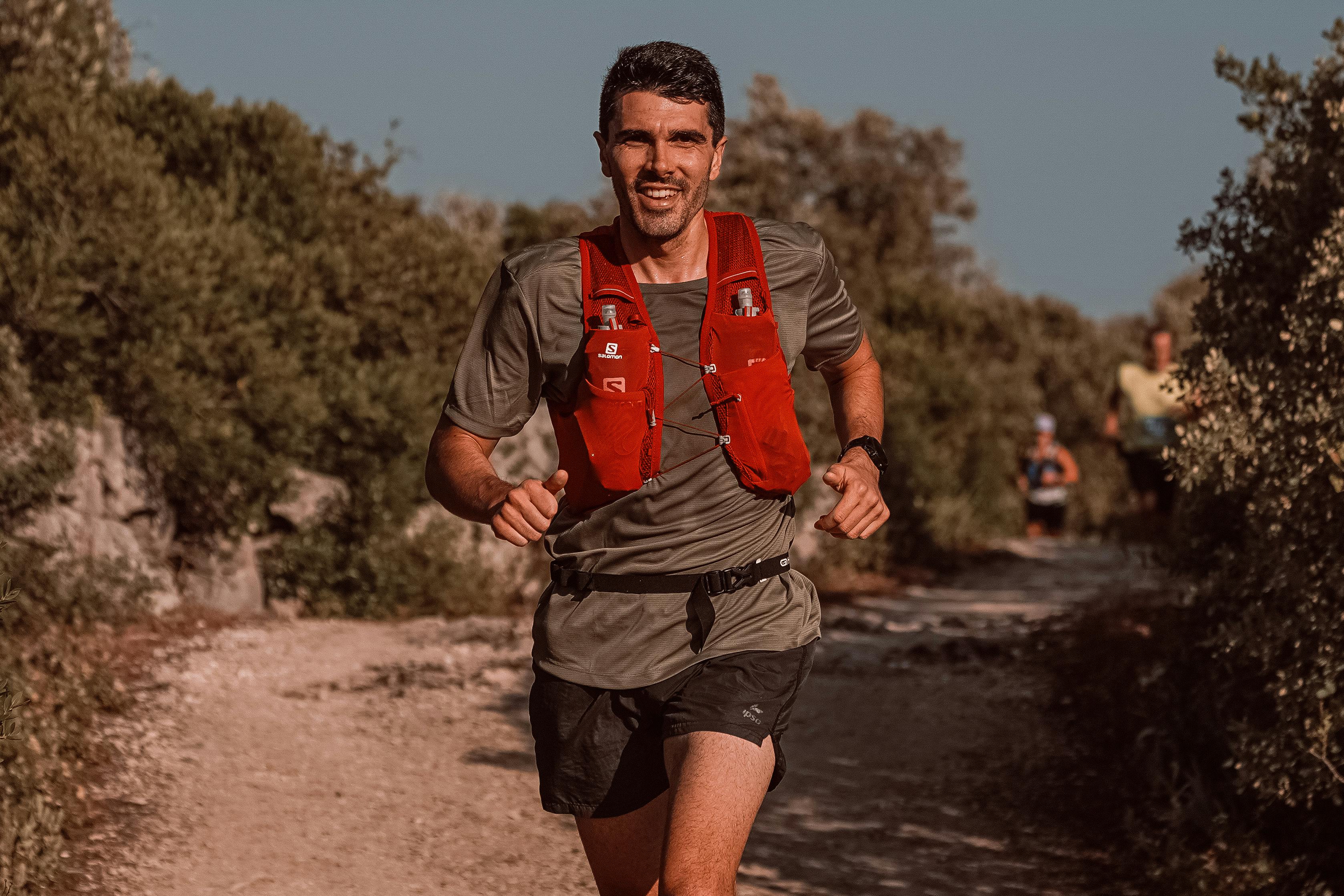 Smiling Man Running in Race · Free Stock Photo