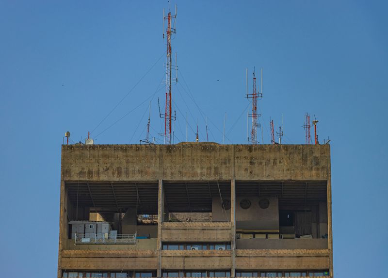 Exposed flat concrete rooftop under direct sun in New Delhi