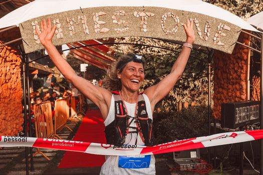 Woman Athlete Crossing Marathon Finish Line