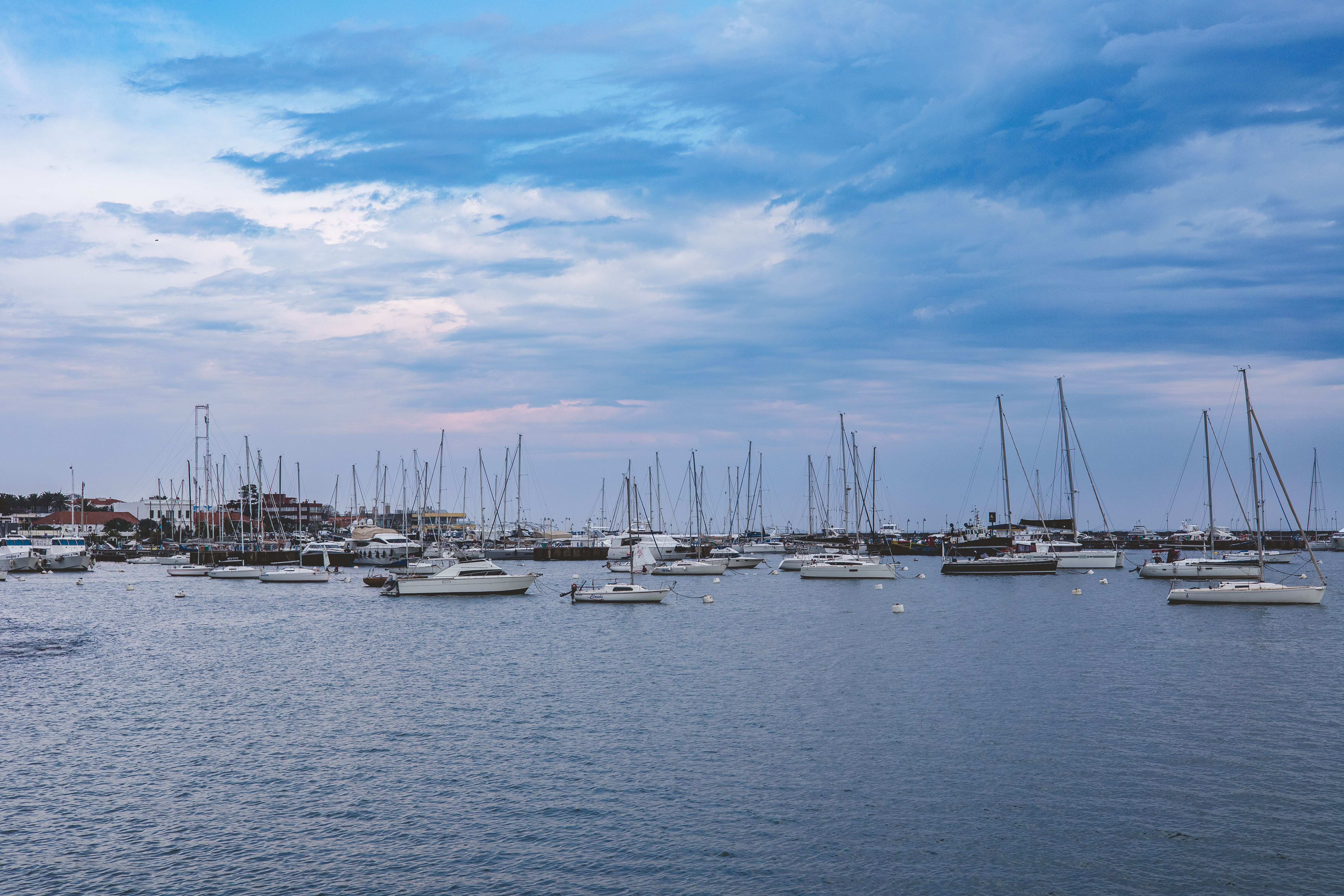 Yachts moored in the Victoria Basin at the V&A Waterfront with Table Mountain behind the hotel balconies