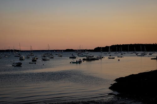 Motor Yachts Moored on Sea Coast at Sunset