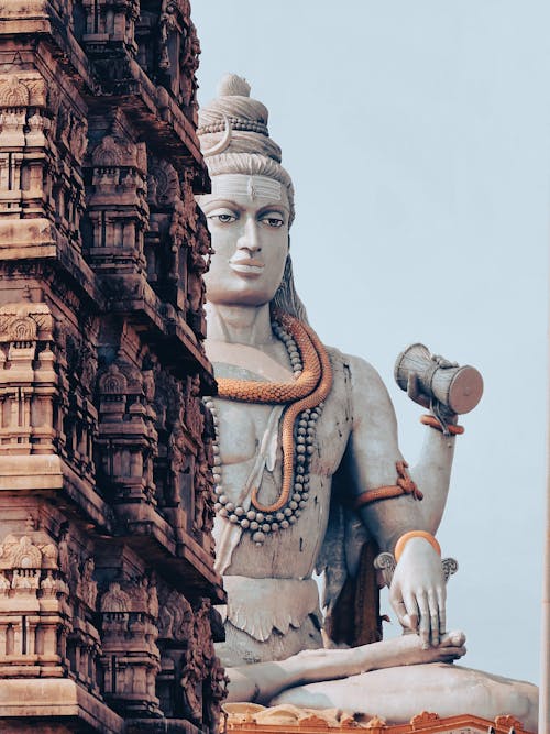 Monumental God Statue behind Temple Wall
