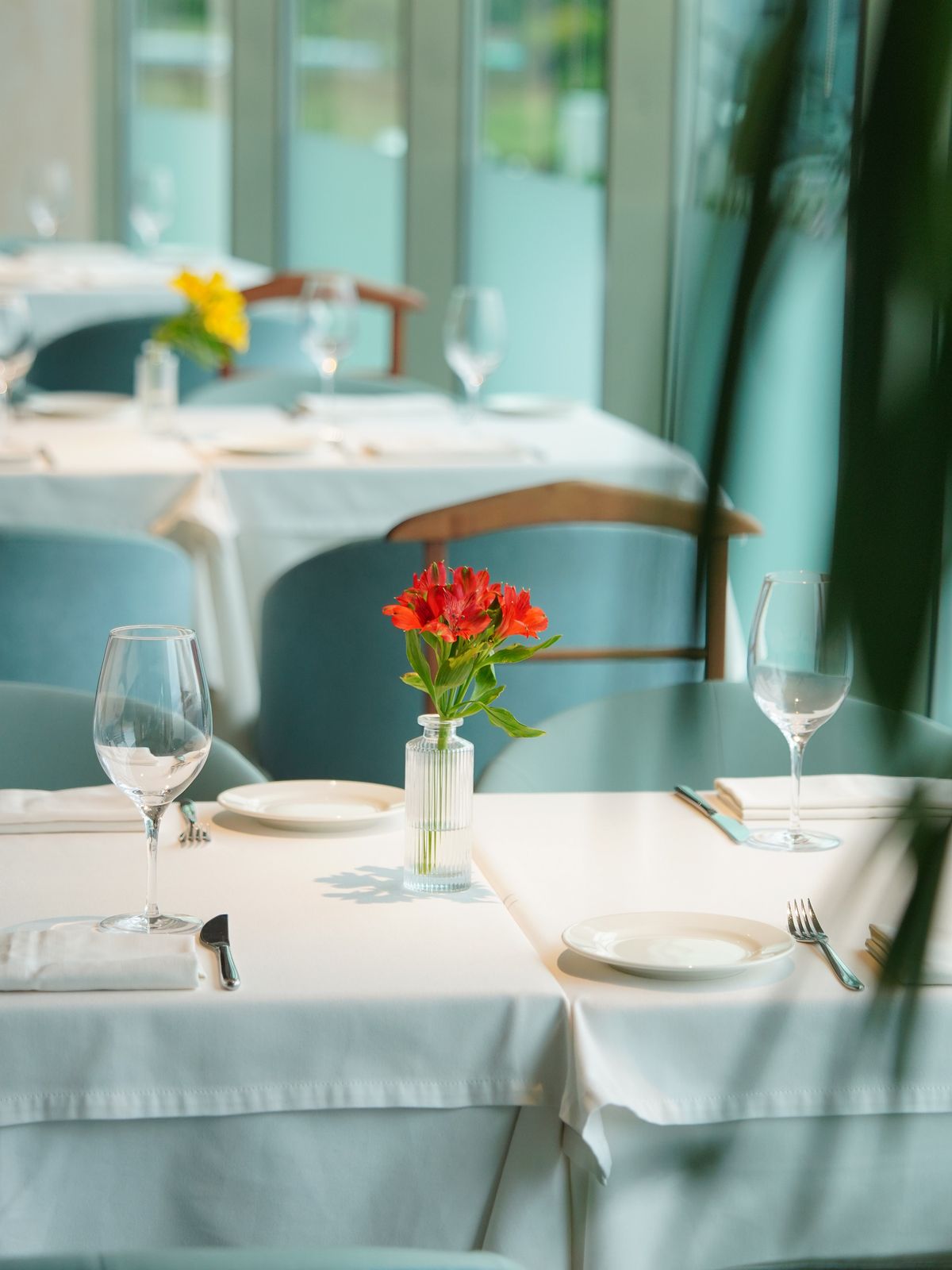 Dining table set by the window.