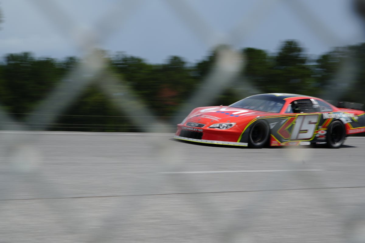 A bowl of lentil soup topped with yogurt, herbs, and lemon