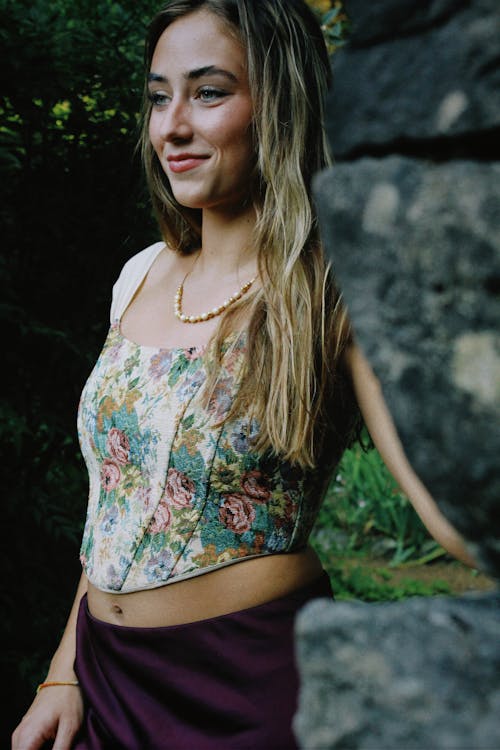 Young Blonde Woman Posing in Floral Corset Top