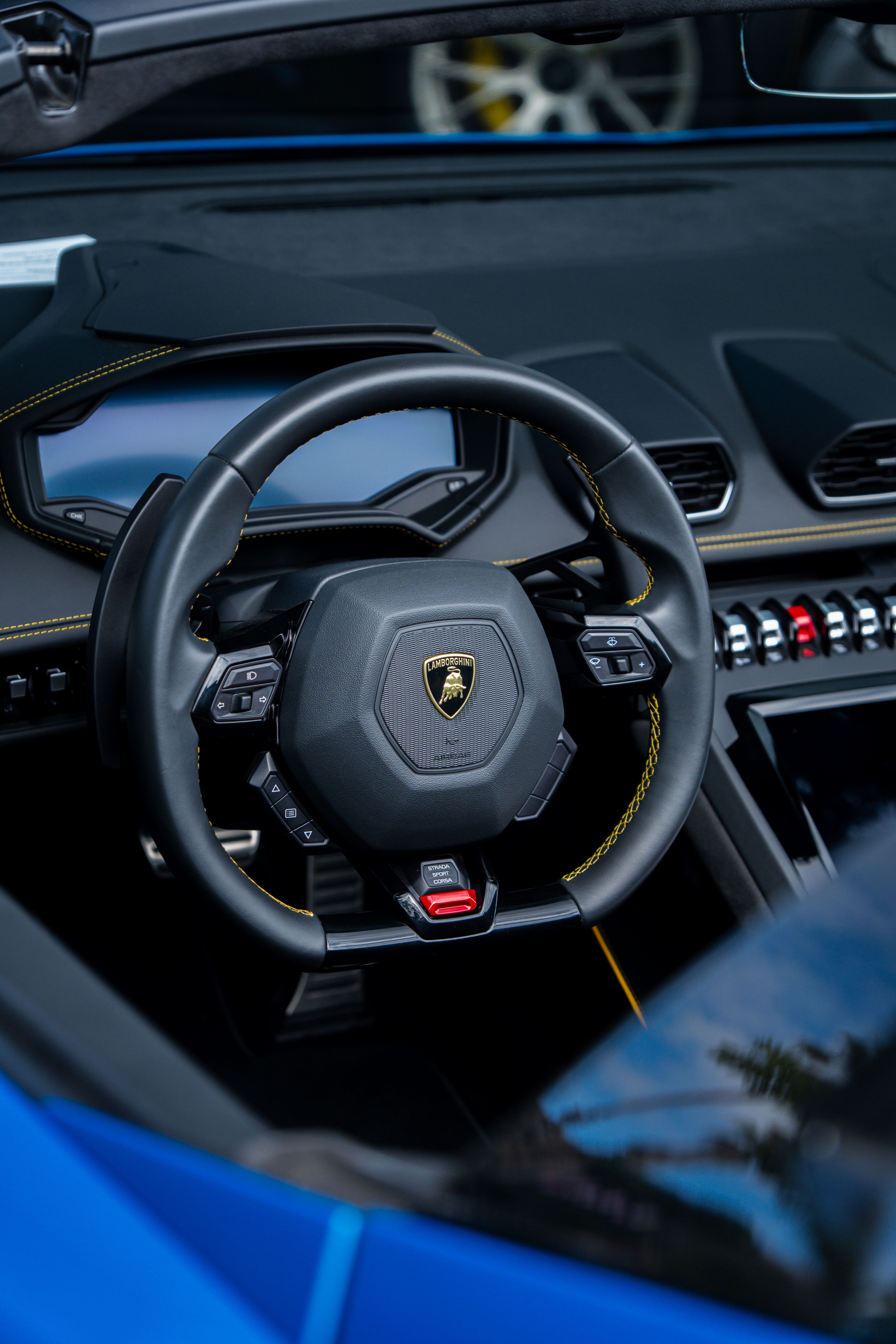 Luxury car interior with stitched leather and gear selector detail