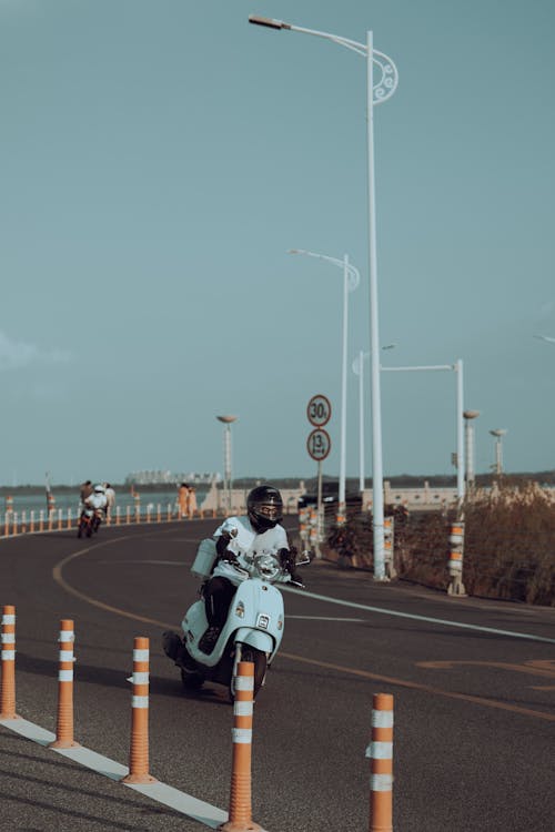 Man Driving Scooter