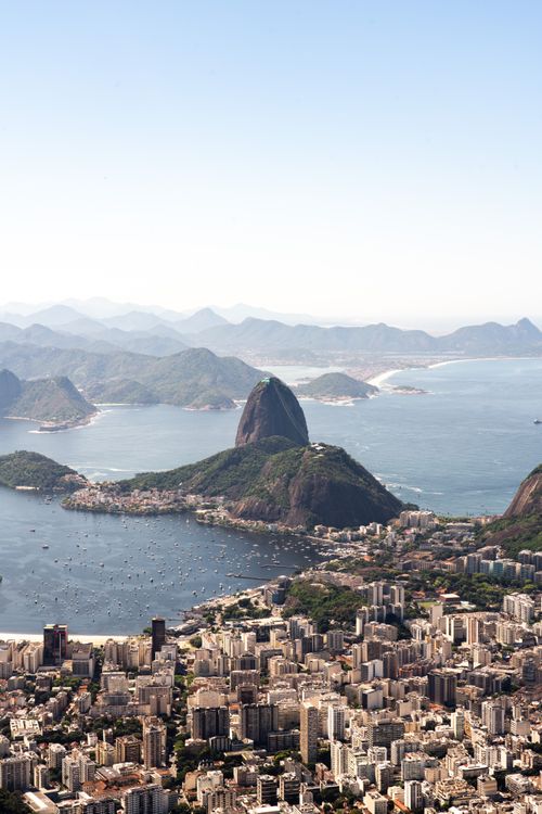 Free A breathtaking aerial shot capturing Rio de Janeiro's cityscape with Sugarloaf Mountain and the coast. Stock Photo