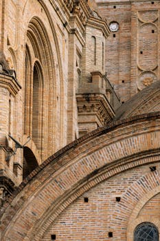A detailed view of the medieval-style brickwork on Cuenca Cathedral, Ecuador.