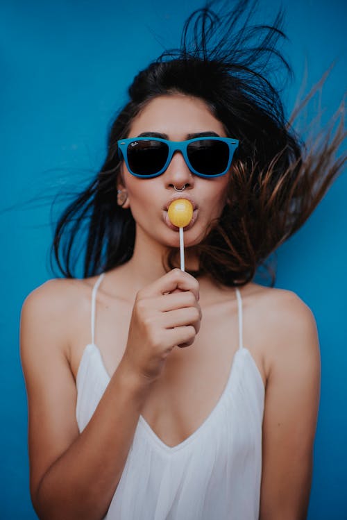 Free Woman Holding Lollipop Stock Photo