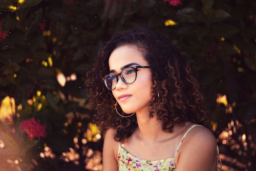 Woman In Yellow Spaghetti Strapped Shirt Wearing Black Framed Eyeglasses