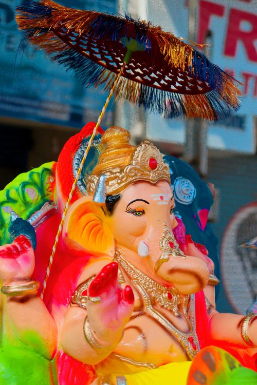 Free Colorful Ganesh statue adorned for a Hindu festival celebration outdoors. Stock Photo