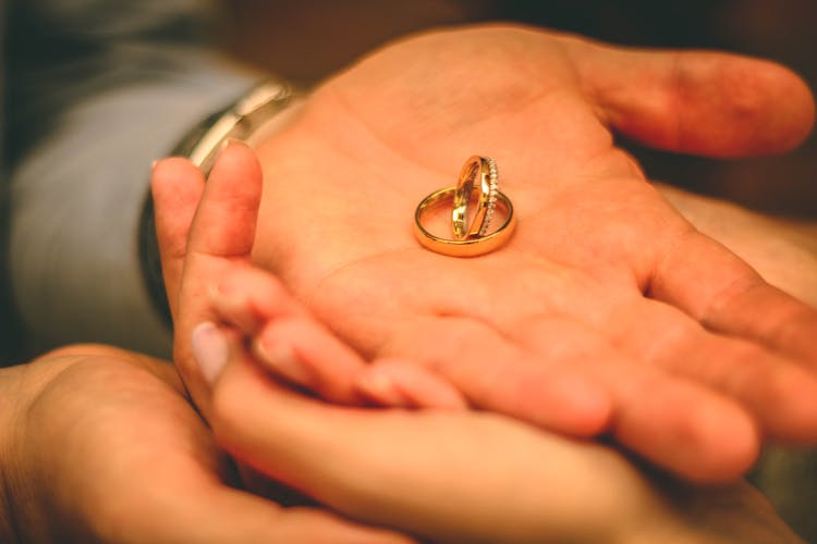 Wedding Bands On Person's Left Hand