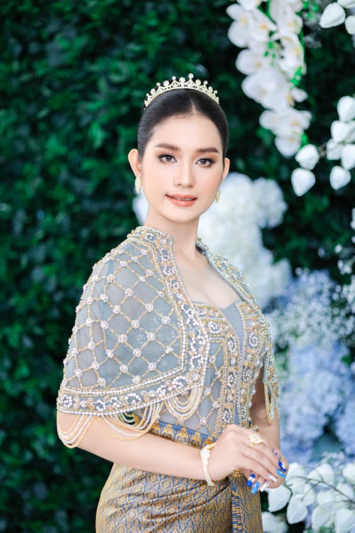 Young Woman in Traditional Clothing and Jewelry 