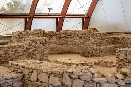 Free Explore the historic stone ruins of Viminacium under protective shelter. Stock Photo