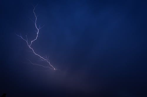 Lightning in the sky over a dark blue sky