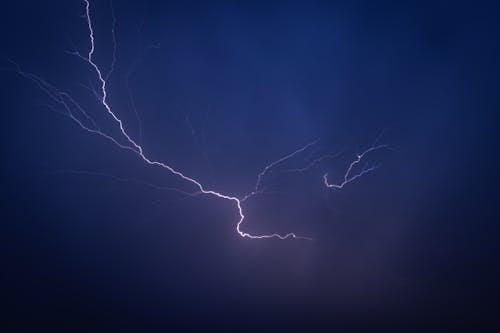 Lightning in the sky over a dark blue sky