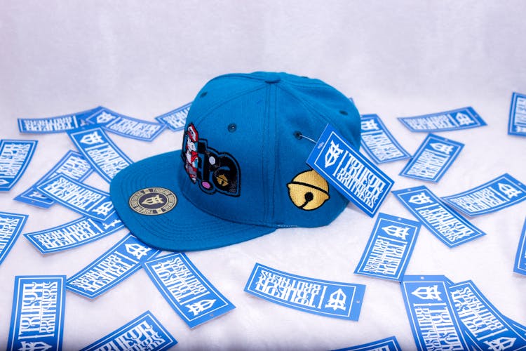 Blue Baseball Cap And Stickers From The Truepa Brothers Online Shop