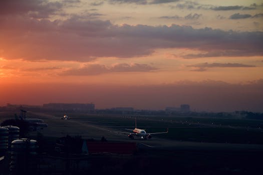 Scenic view of airplanes on a runway during sunrise in Ho Chi Minh City, Vietnam.