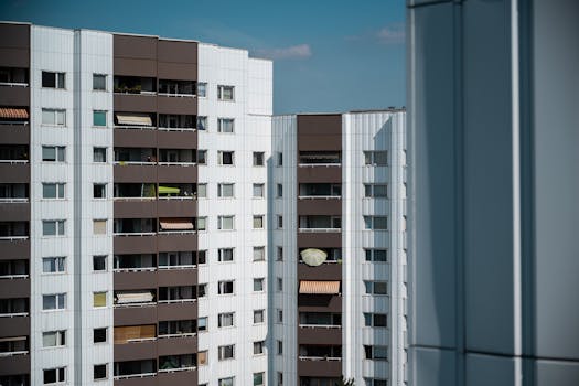 High-rise modern apartment buildings in Berlin showcasing urban architecture under clear daylight.