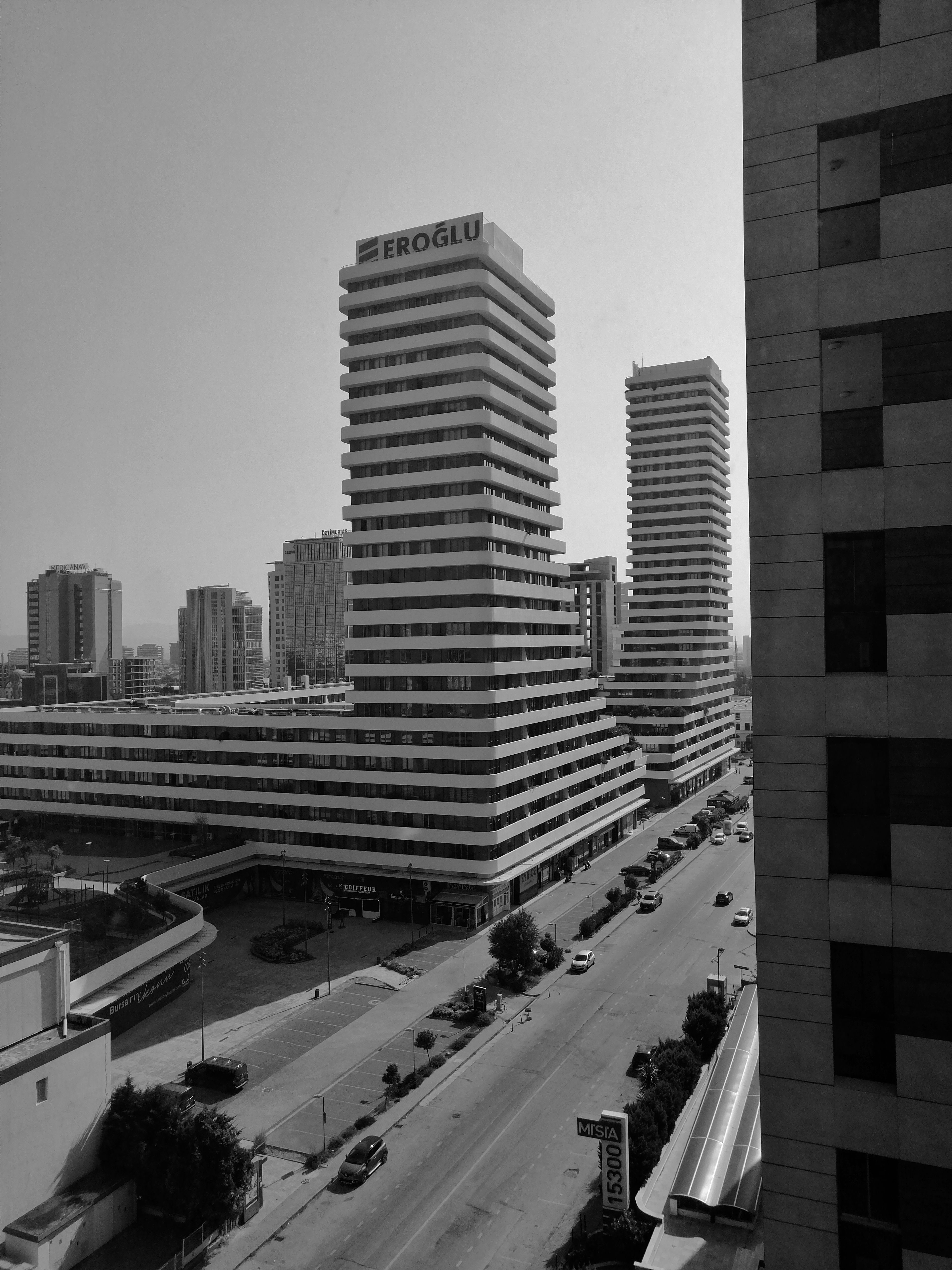 Aerial view of modern architecture in Bursa, showcasing high-rise buildings in black and white.