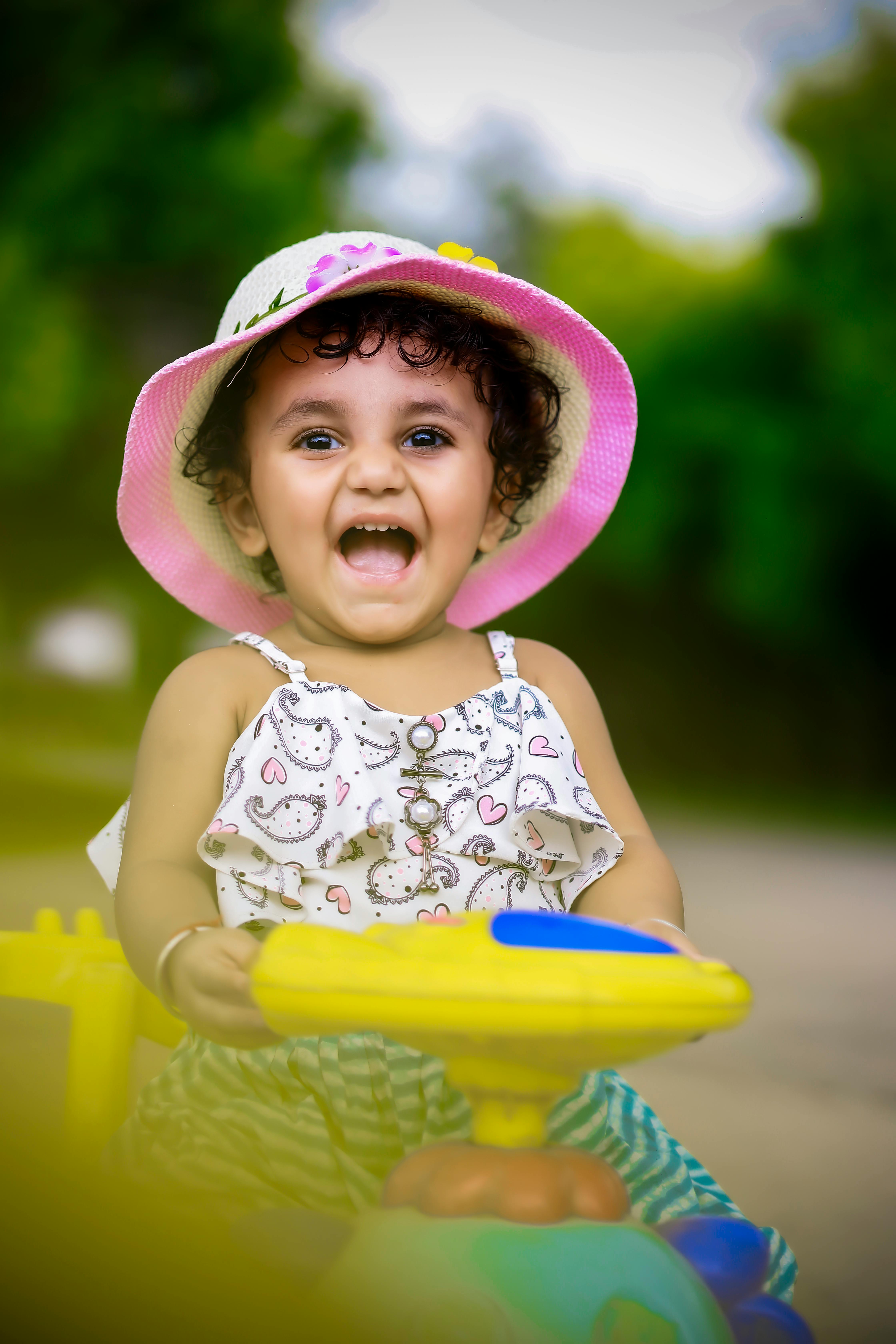 Happy Child on Toy Car · Free Stock Photo