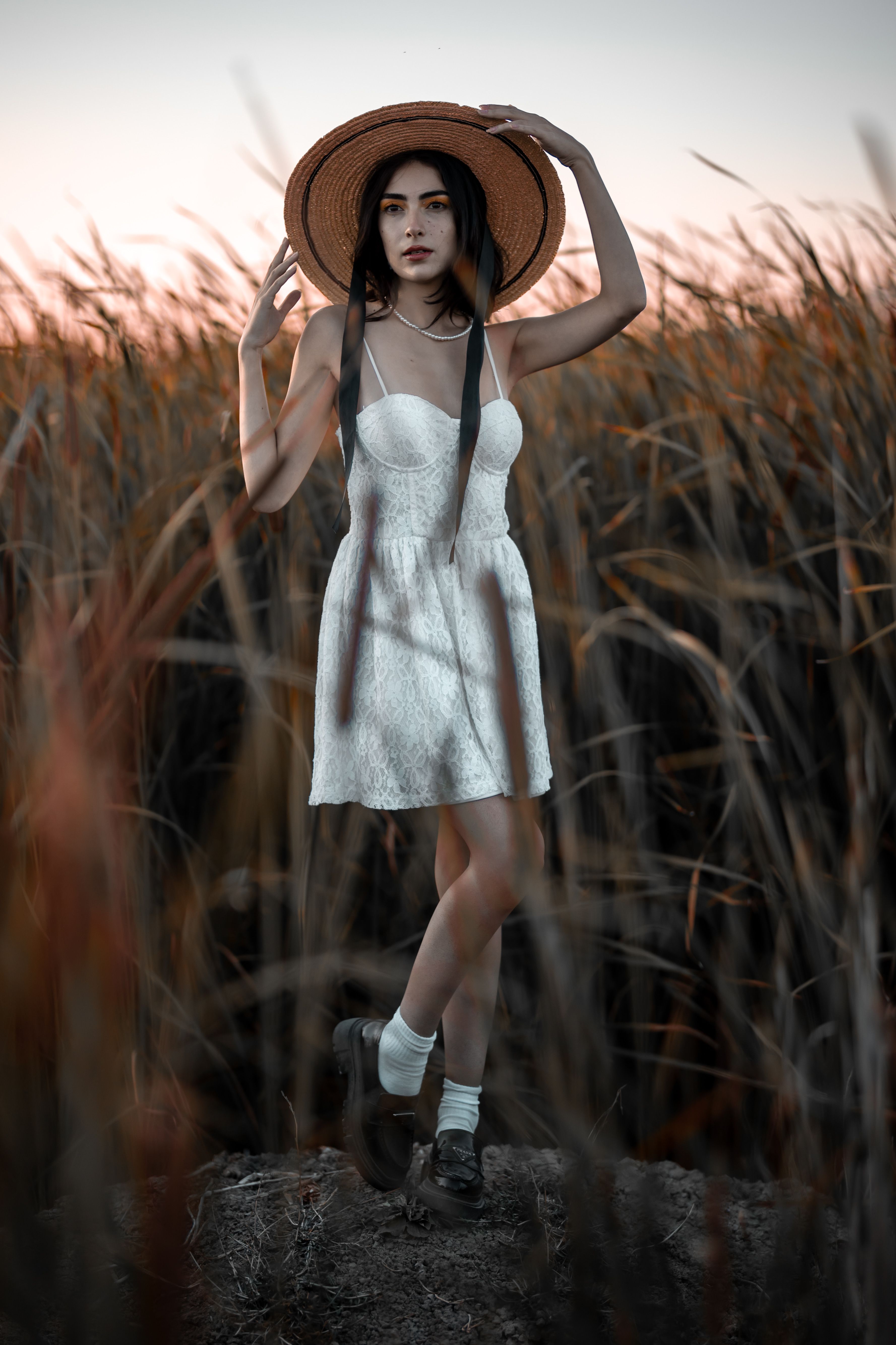 Model in Summer Dress and Hat in the Evening · Free Stock Photo