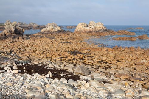 Free Explore the stunning rocky coastal landscape of Plougrescant, captured in Brittany, France. Stock Photo
