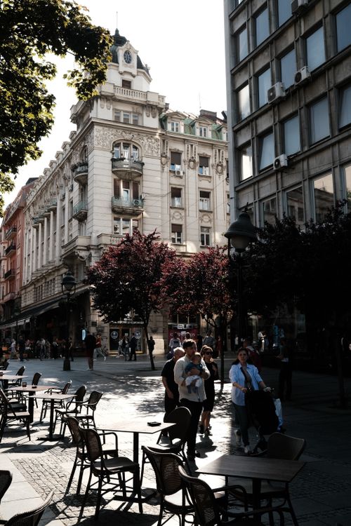 Free Quaint street view in Belgrade, Serbia's old town with people and outdoor cafes. Stock Photo