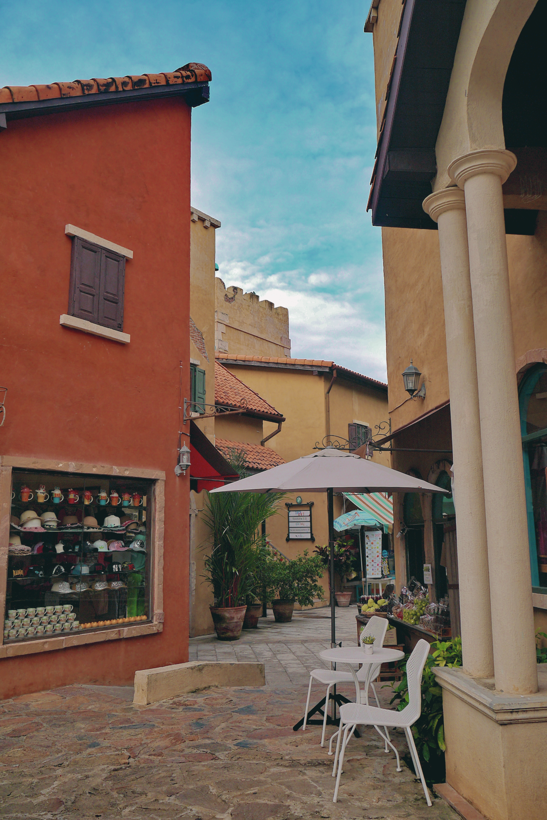 A Cobblestone Street between Buildings in a Town · Free Stock Photo