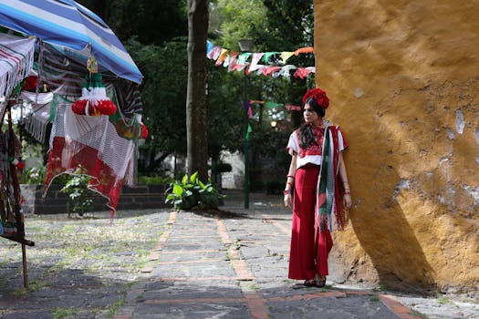 Woman in traditional Mexican attire enjoys a colorful street market scene. Vibrant cultural elements on display.